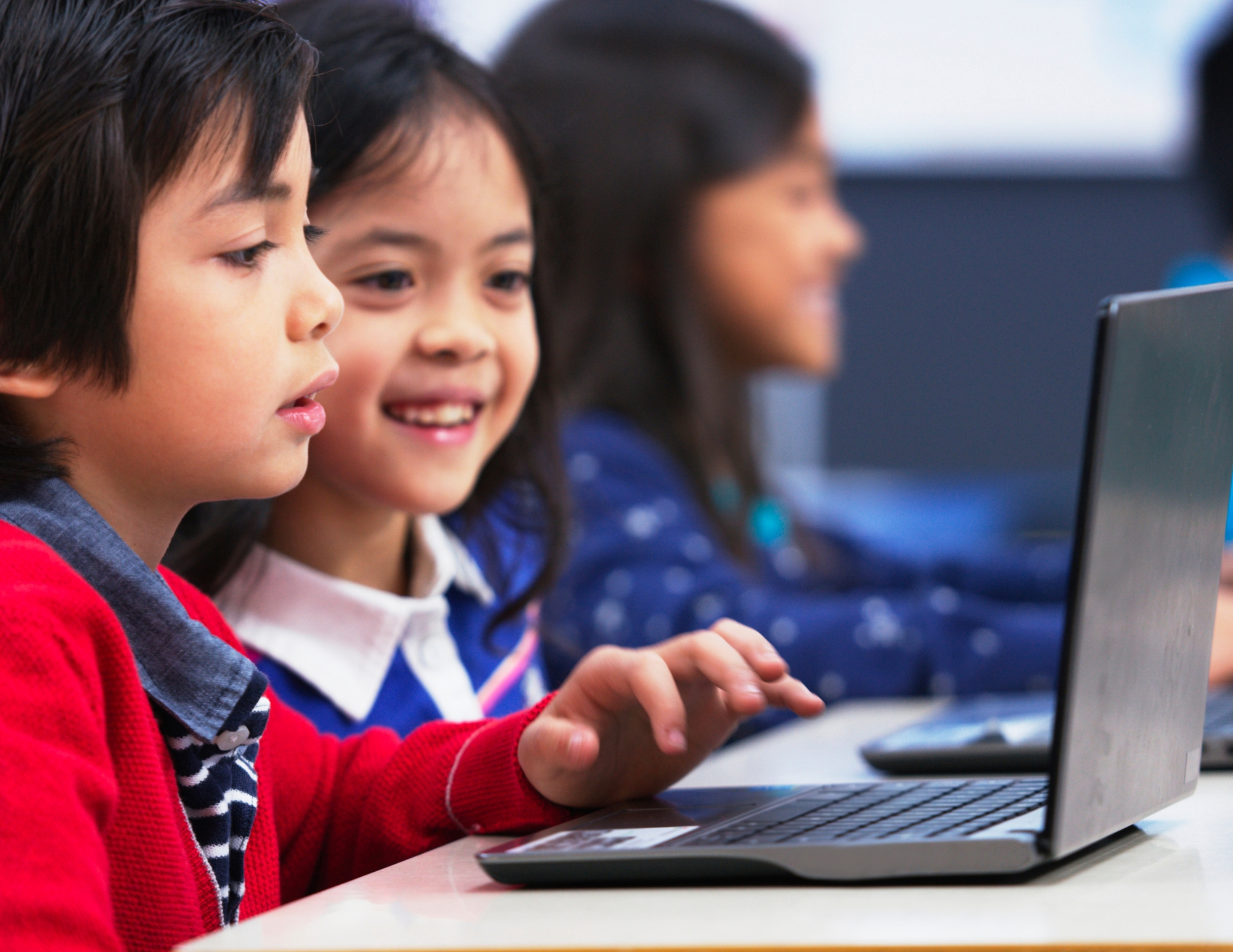 Students learning with laptops